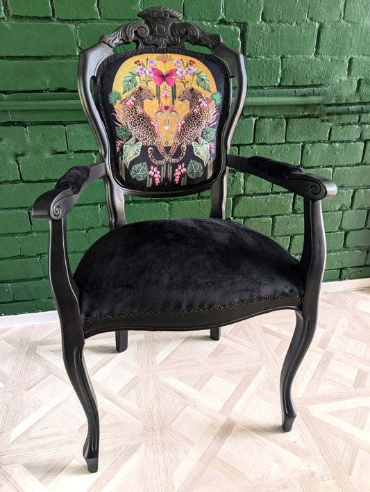 Louis style statement chair, botanical leopard print. Eclectic, maximalist. Sprayed black.